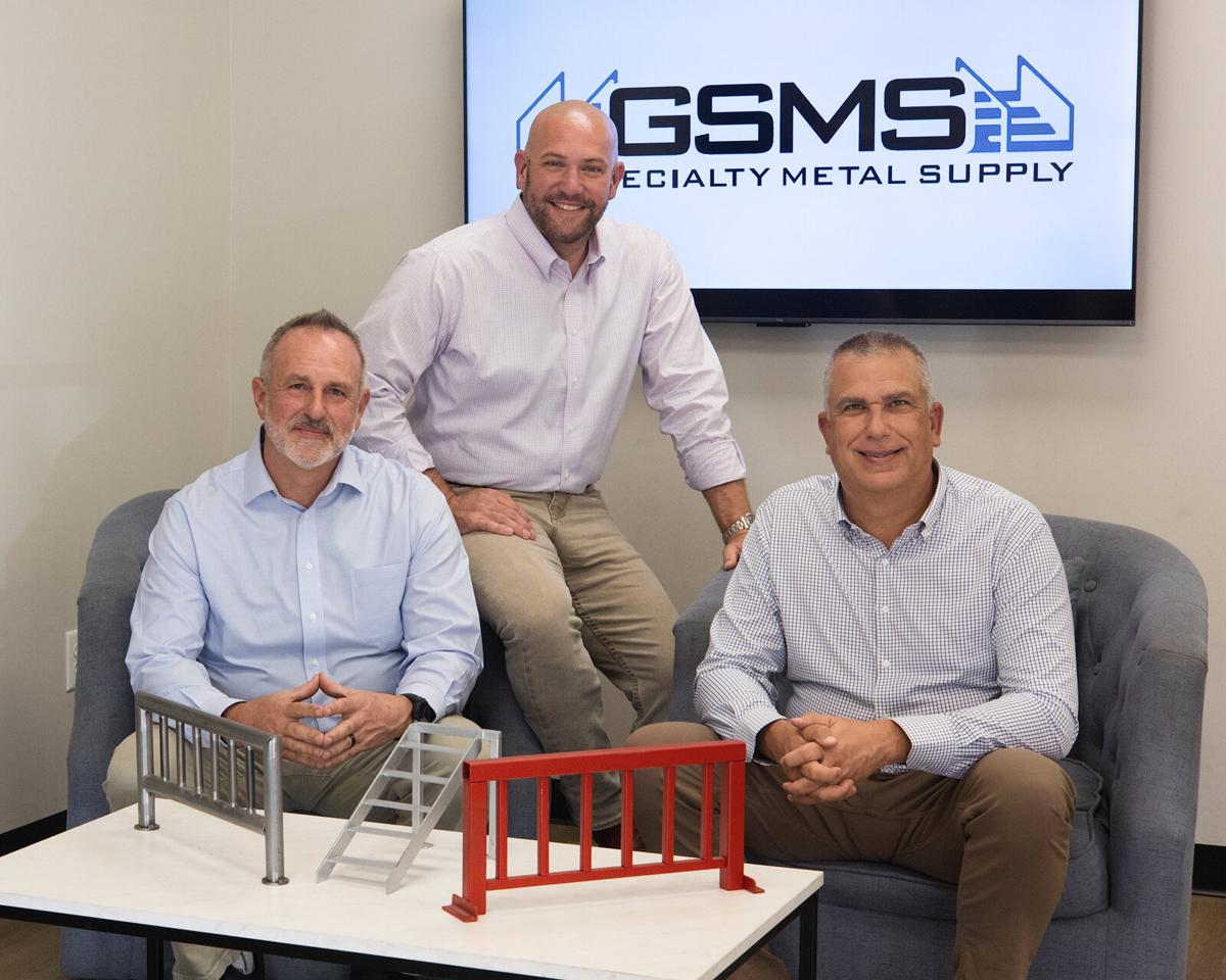 Team branding photo of three business owners in their Specialty Metal Supply office