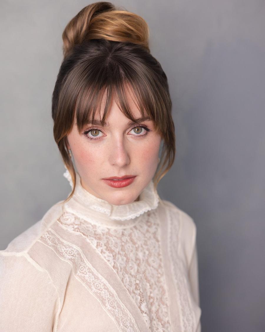 Actor headshot of a young woman in a lace high-neck blouse
