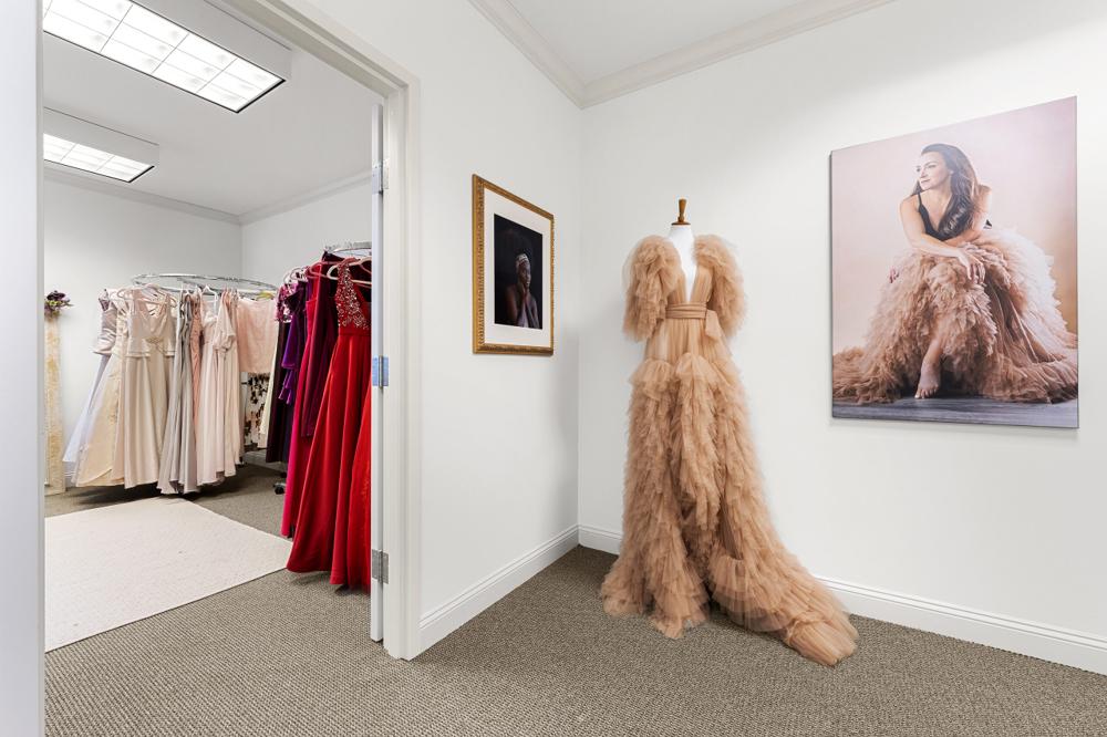 Entrance to the wardrobe room with a blush tulle gown on display