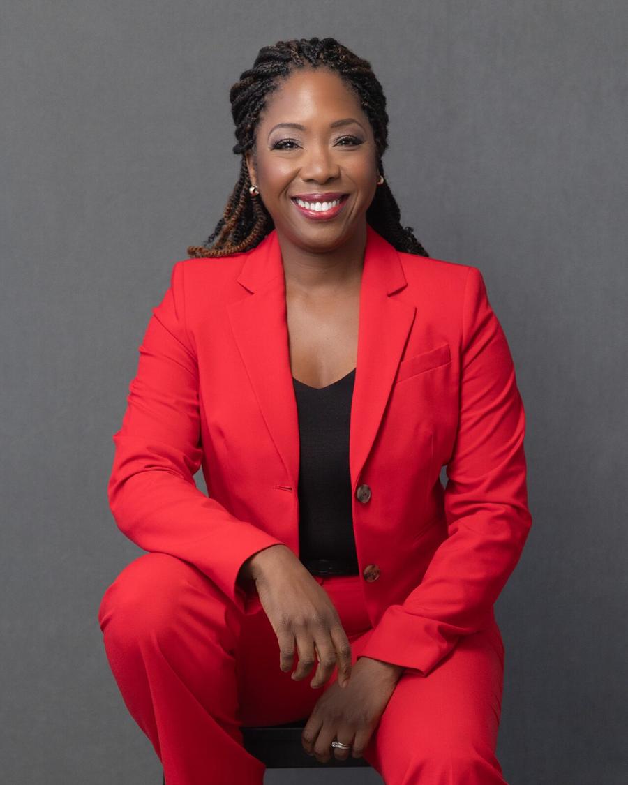 Professional headshot session — smiling woman in a red suit