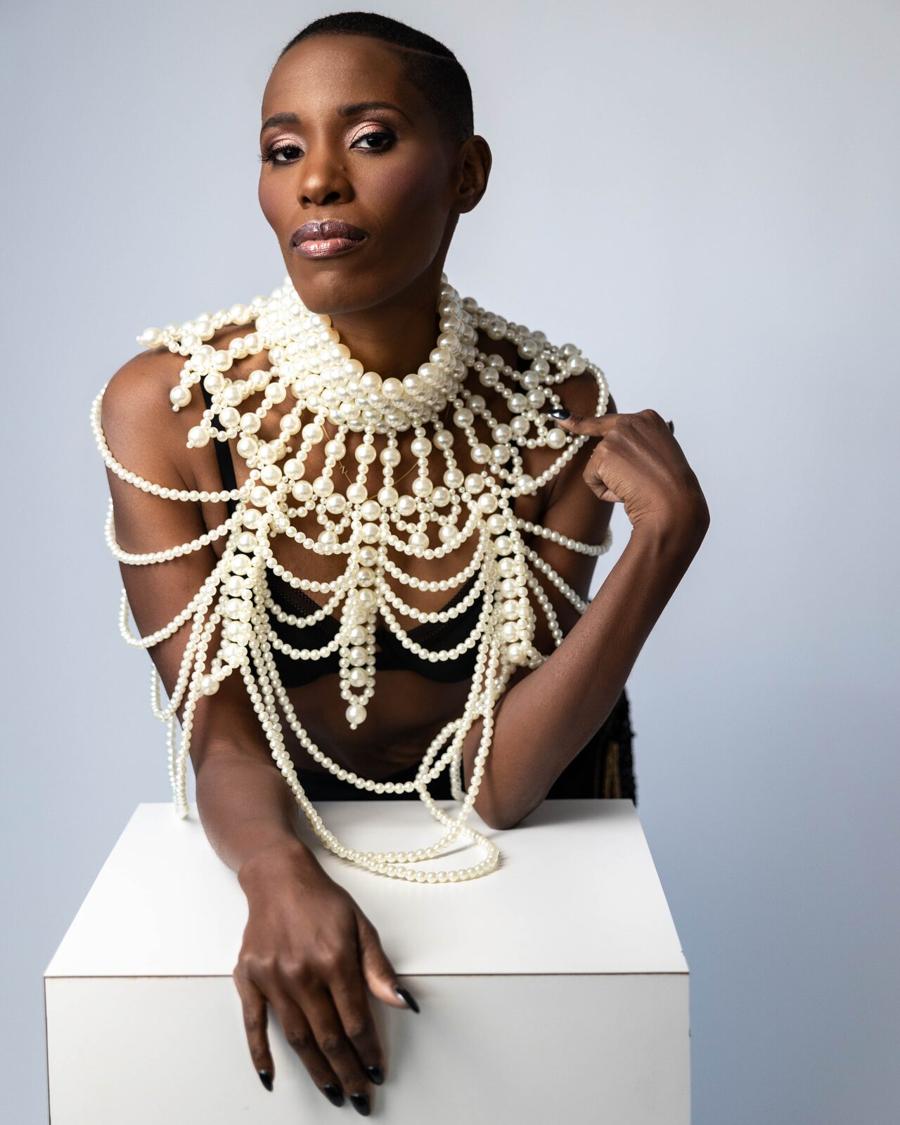 Editorial portrait session — woman in a pearl collar and bodice